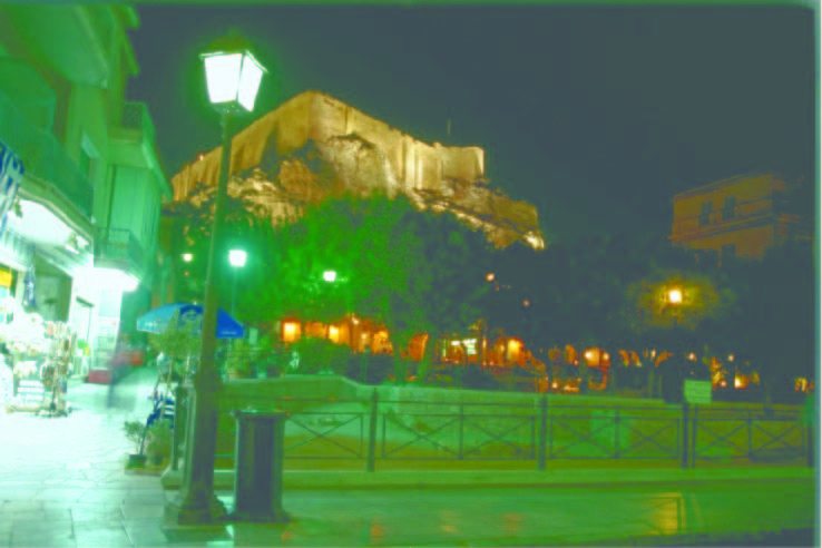 An illuminated Parthenon as viewed from the historic district of Plaka